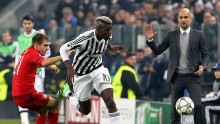 Incoming Manchester City manager Pep Guardiola (extreme right) looks at Juventus midfielder Paul Pogba in action against his current squad Bayern Munich