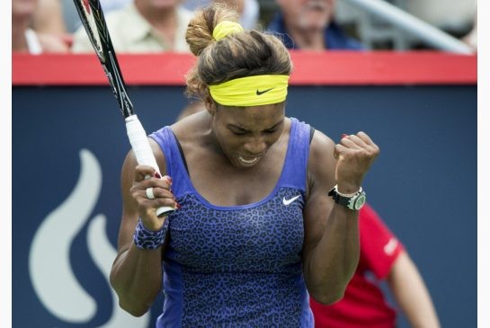 Serena Williams clinches her fist after winning her quarter-final matchup against Caroline Wozniaki at the Rogers Cup