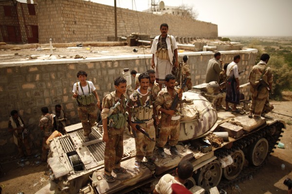Army soldiers stand atop a tank at their position in Jaar of Yemen's southern province of Abyan, after the army retook it from al Qaeda-linked militants June 15, 2012.