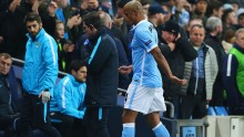 Manchester City center back Vincent Kompany walks off the pitch after suffering an injury