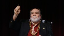 Hawaii Governor Neil Abercrombie holds up the pen after signing Senate Bill 1
