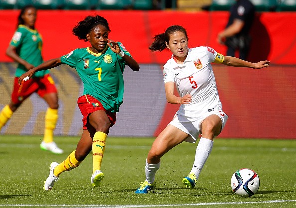 Wu Haiyan #5 of China PR in action against Gabrielle Onguene #7 of Cameroon during the FIFA Women's World Canada 2015 Round of 16 match between China PR and Cameroon at Commonwealth Stadium on June 20, 2015 in Edmonton, Canada. (Photo: Kevin C. Cox/Getty 