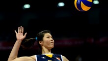 Ting Zhu of China delivers a cross the court spike against Italy