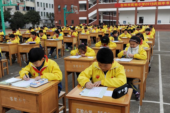  Primary Students Compete Calligraphy To Welcome New Year In Dongyang (Photo: ChinaFotoPress/ChinaFotoPress via Getty Images)