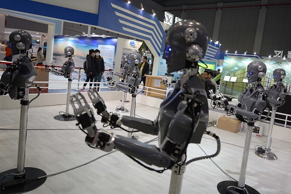 Industrial robots 'dance' at a booth the day before the 2015 China International Industry Fair at National Exhibition and Convention Center on Nov. 2, 2015 in Shanghai, China.  (Photo: ChinaFotoPress/ChinaFotoPress via Getty Images)