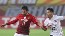 Guangzhou Evergrande midfielder Ricardo Goulart competes for the ball against Urawa Red Diamons' Abe Yuki during their recent AFC Champions League game