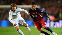 Barcelona winger Neymar (R) competes for the ball against Real Madrid's Luka Modric in the recent El Clásico match