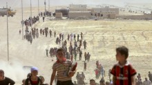 Displaced people from the minority Yazidi sect, fleeing violence from forces loyal to the Islamic State in Sinjar town.