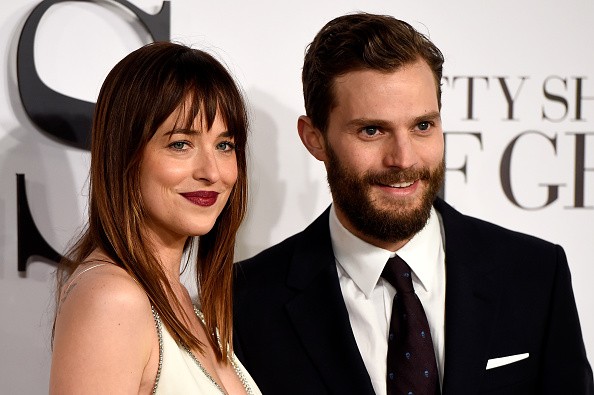 Dakota Johnson and Jamie Dornan attend the UK Premiere of 'Fifty Shades Of Grey' at Odeon Leicester Square on February 12, 2015 in London, England.