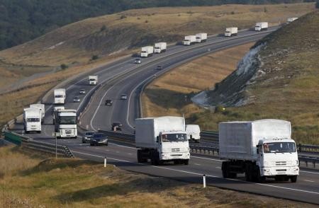 A Russian convoy of trucks carrying humanitarian aid for Ukraine travels along a road south of the city of Voronezh August 14, 2014.