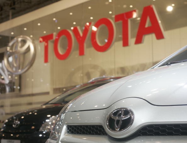 Toyota says China's new rules on emission and fuel is giving the company a hard time to reach quota.