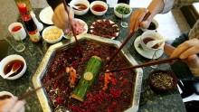 Chinese People Enjoy Hot Pot At A Restaurant