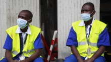 Workers wearing protective masks