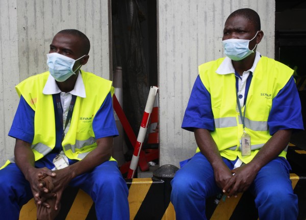 Workers wearing protective masks