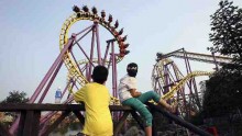 Tourists Visit Theme Park 'Happy Valley' In China