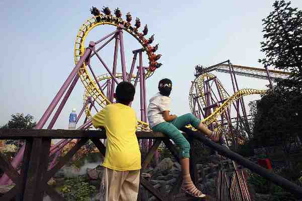 Tourists Visit Theme Park 'Happy Valley' In China