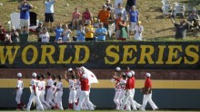 Tokyo, Japan players wave to fans as they run the outfield after defeating Goodlettsville, Tennessee in the Little League World Series championship baseball game in Williamsport, Pennsylvania, August 26, 2012. 