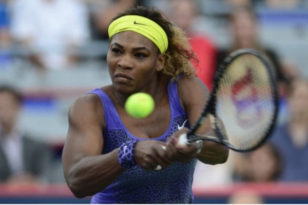 World No. 1 Serena Williams returns a double-handed backhand against Caroline Wozniacki in the Western and Southern Open in Cincinnati