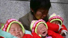 A Couple And Their Triplets Beg In Beijing