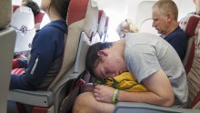 Passenger sleeps on a plane
