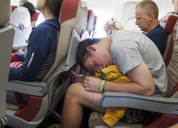 Passenger sleeps on a plane