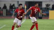 Guangzhou Evergrande midfielder Ricardo Goulart (R) and teammate Zhang Linpeng