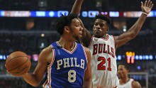 Sixers' center Jahlil Okafor (L) looks for a pass against Chicago's Jimmy Butler