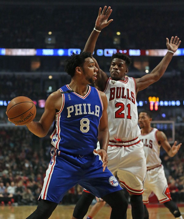 Sixers' center Jahlil Okafor (L) looks for a pass against Chicago's Jimmy Butler