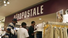 Customers wait in line at an Aeropostale store in New York 