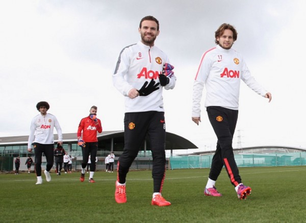 Manchester United players Juan Mata (L) and Daley Blind
