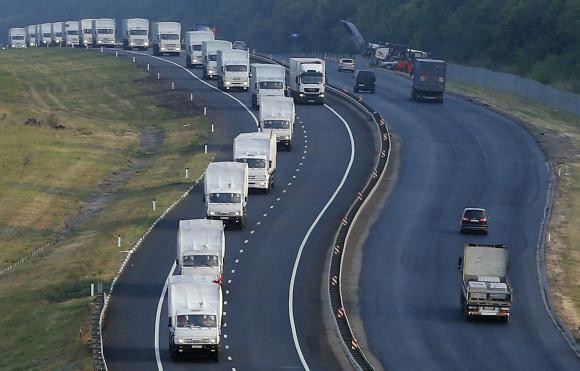 A Russian convoy of trucks carrying humanitarian aid for Ukraine travels along a road south of the city of Voronezh August 14, 2014 