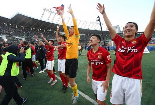 Guangzhou Evergrande players celebrate after winning the championship last season