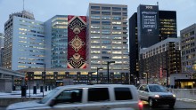 Famous street artist Shepard Fairey's 184-foot by 60-foot mural on the side of the One Campus Martius building is seen in downtown March 2, 2016 in Detroit, Michigan.