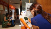 Robot Of Artificial Intelligenc Interacts With Customers