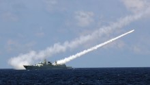 Missile destroyer Guangzhou launches an air-defense missile during a military exercise in the water area near south China's Hainan Island and Xisha islands, July 8, 2016