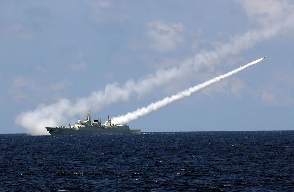 Missile destroyer Guangzhou launches an air-defense missile during a military exercise in the water area near south China's Hainan Island and Xisha islands, July 8, 2016
