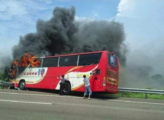 A Taiwan tour bus carrying visitors from mainland China has crashed and caught fire near the capital Taipei, killing 26 on board.