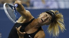 Maria Sharapova serves up against fellow Russian Maria Kirilenko at the opening day of the US Open in Flushing Meadows
