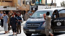 An Islamic State militant announces taking of Tabqa air base Sunday