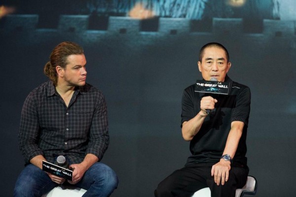 Director Zhang Yimou, right, speaks next to actor Matt Damon during a news conference of their latest movie "The Great Wall" held at a hotel in Beijing