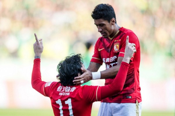 Guangzhou Evergrande players Ricardo Goulart (L) and Paulinho