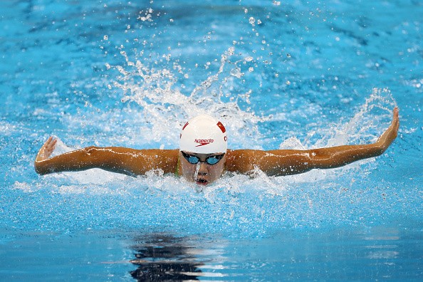 Xinyi Chen of China competes in heat four of the Women's 100m Butterfly on Day 1 of the Rio 2016 Olympic Games at the Olympic Aquatics Stadium on on August 6, 2016 in Rio de Janeiro, Brazil.
