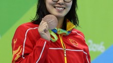 Bronze medalist Yuanhui Fu of China on the podium during the medal ceremony for the Women's 100m Backstroke Final on Day 3 of the Rio 2016 Olympic Games at the Olympic Aquatics Stadium on August 8, 2016 in Rio de Janeiro, Brazil. 