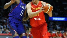 Yi Jianlian #11 of China drives to the basket against Kevin Durant #5 of the United states during the first half of a USA Basketball showcase exhibition gameat Staples Center on July 24, 2016 in Los Angeles, California.