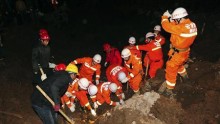 Rescuers search for landslide survivors