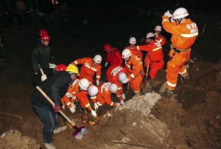 Rescuers search for landslide survivors
