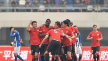 Liaoning Whowin players celebrate after a goal