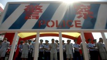 Police parade convicted criminals during a public sentence August 1, 2006 in Shenzhen of Guangdong Province, China. 