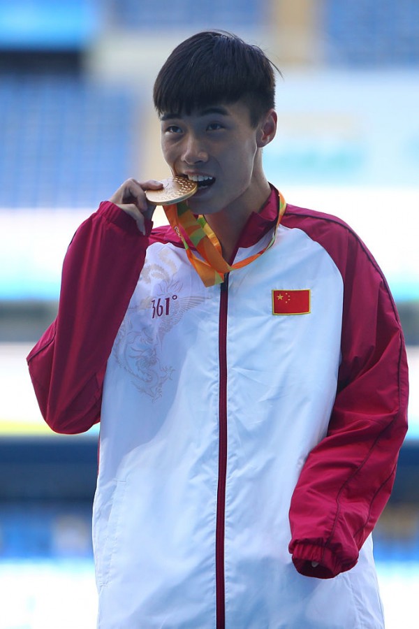 Gold medalist Guangxu Shang of China poses on the podium at the medal ceremony for Men's Long Jump - T37