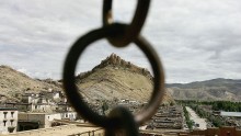 The former local government palace is framed by an iron ring in Gyantse township of Tibet, China.